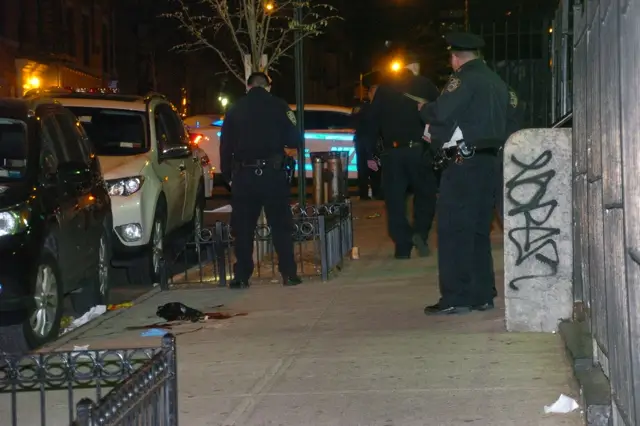 Officers at the scene of the Washington Heights shooting